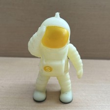 Astronaut figure saluting pose