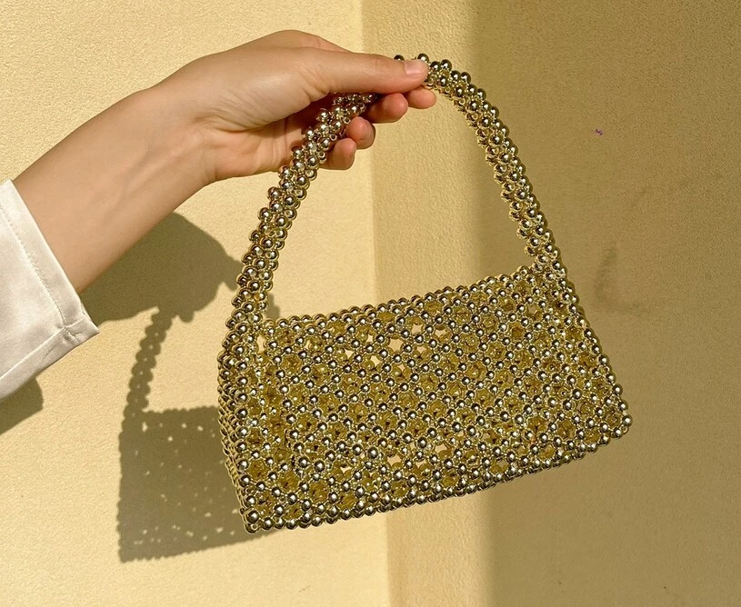 Bolso de mano para axilas de un solo hombro tejido hueco abatible de moda para mujeres Nuevo Foto 2 de 4