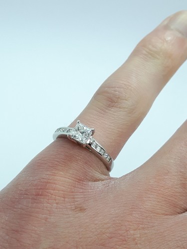 18ct White Gold 0.61ct Diamond Solitaire & 0.14ct accent engagement ring - Picture 15 of 16