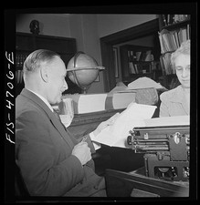 Photo:Office Workers with Typewriter 1930s Men Reviewing Papers thumbnail