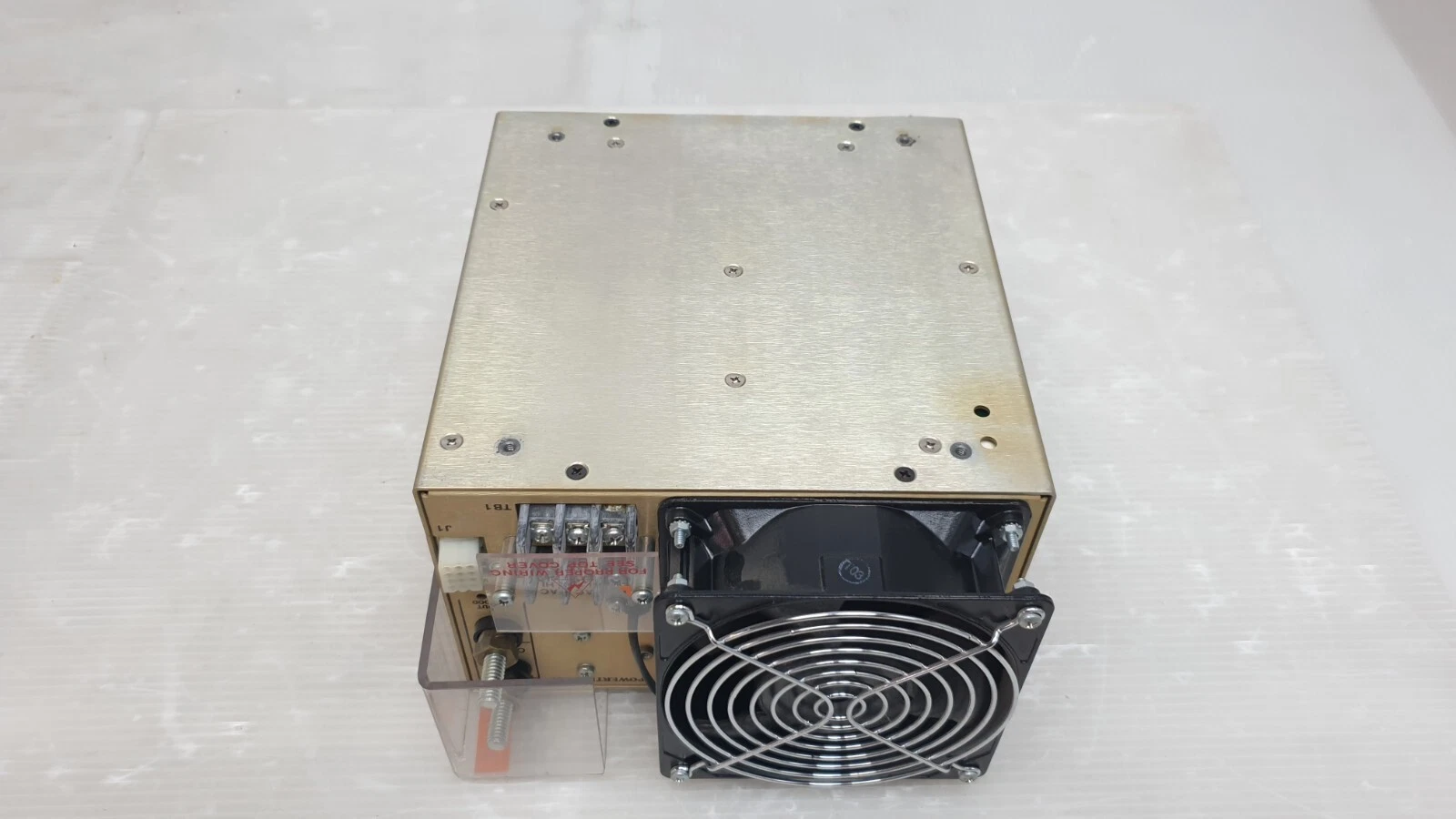Plain unlabeled panel of the Powertec 48V power supply, with terminal blocks and fan