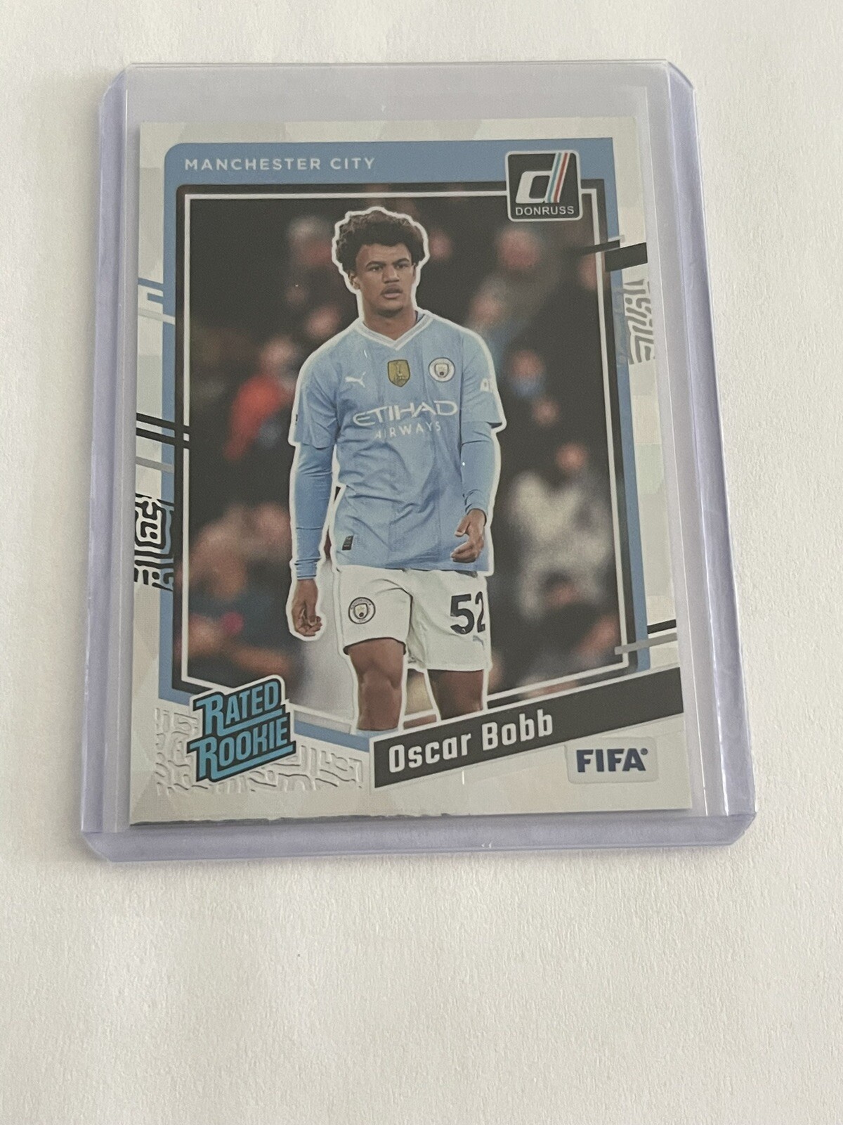 Oscar Bobb 2023-24 Panini Donruss Cubic Manchester City Rated Rookie Card #178