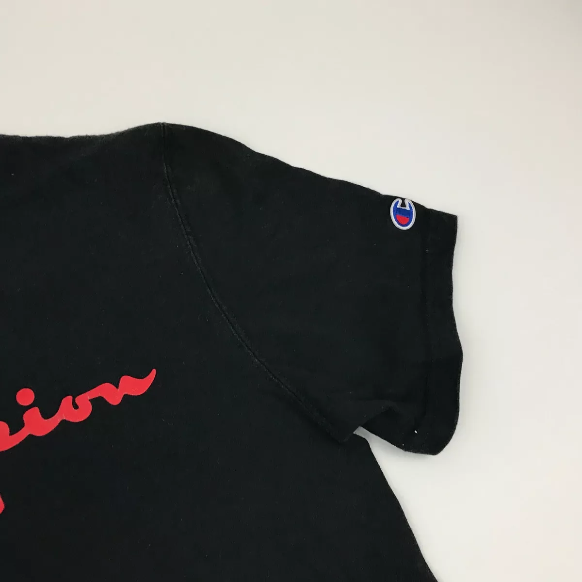 Red black and store white champion shirt