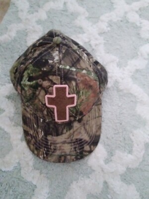 Womens ball cap with a cross.