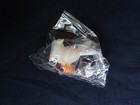 tiny white plastic bunny in package — photo 7