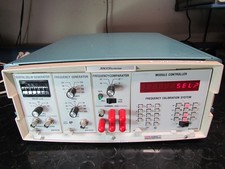 ARGO SYSTEMS AS210A FREQUENCY CALIBRATION SYSTEM / FREQUENCY STANDARD