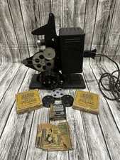 KEYSTONE 16 MM PROJECTOR MOTOR DRIVEN AND HAND CRANK MODEL E 729 AND MOVIES