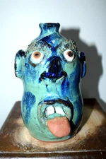 billy joe craven , junior ()  face jug, pottery,  folk art 8''x5''