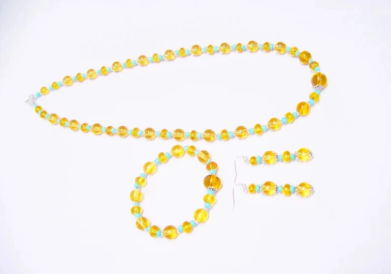 Collar/pulsera/pendientes redondos de resina naranja claro con cuentas electrónicas de vidrio turquesa Se Foto 4 de 4