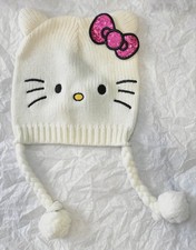 Kids, Hello Kitty Ivory Knit Trapper Hat with Braided Tassels, Bow, and Pom Poms