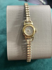 Reloj suizo vintage Gübelin de oro macizo de 18 quilates para dama 17 joyas cuerda manual 1950