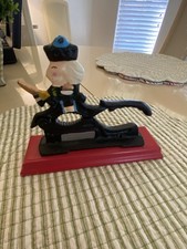 Vintage Cast Iron Nutcracker W/Hand Painted Soldier on Red Wood Base 7.5"