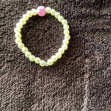 Cute  yellow braclet with pink smiley face