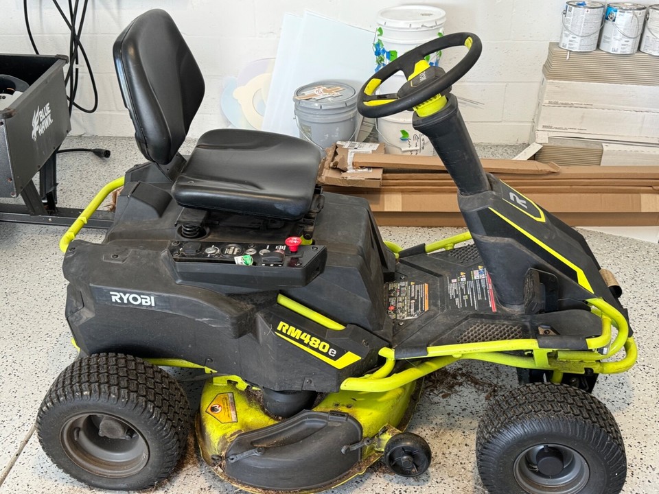 Ryobi RM480e Electric Riding Lawn Mower comes with 10 cu. Feet Steel