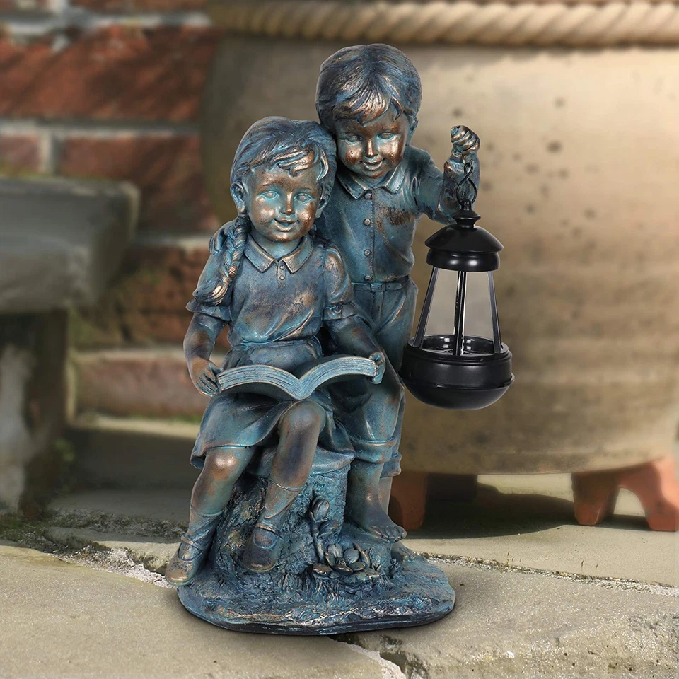 Escultura de jardín, imitación bronce niño y niña solar jardín estatua, linterna LED,... Foto 4 de 4