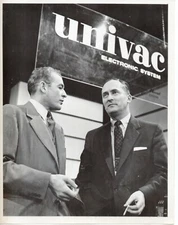 T8-73228. Press Photo CBS TV "Univac Electronic System CEO smokes 1950s glossy