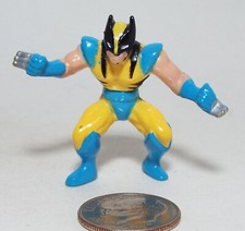 Small Plastic Figure of a Hero Fighter in Yellow with Blue trim Bendable 
