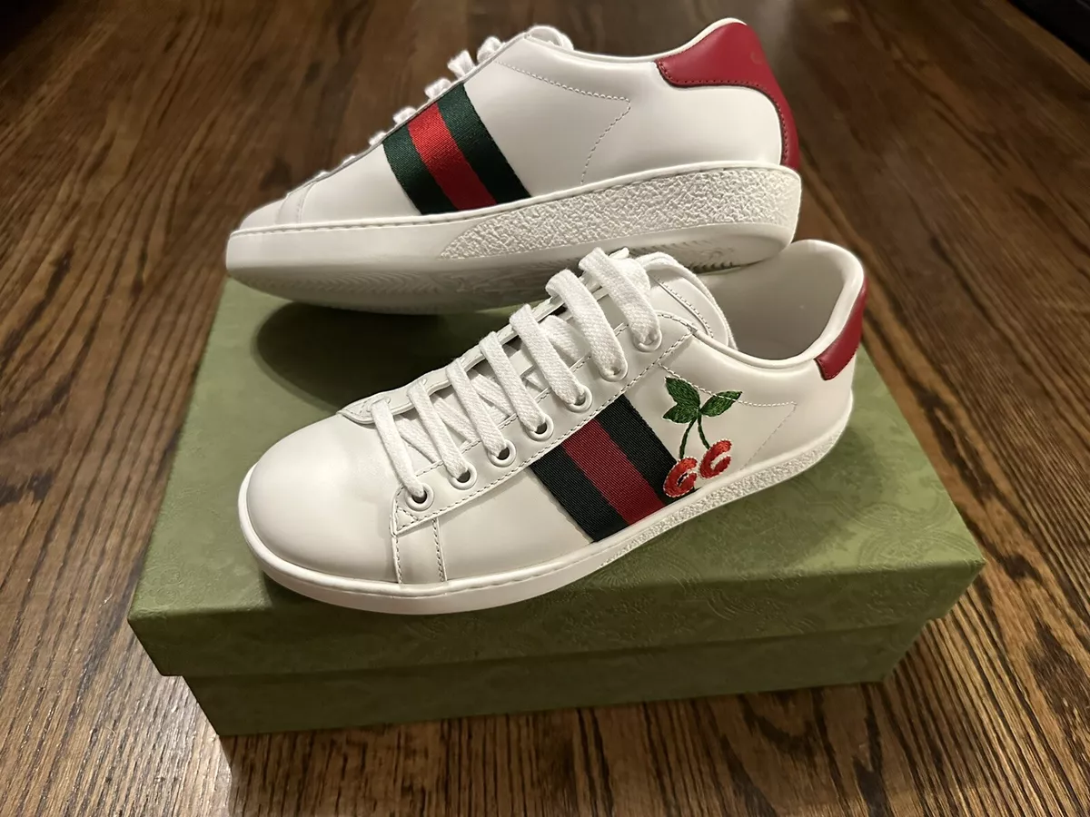 White sneakers with green and red stripe 2025
