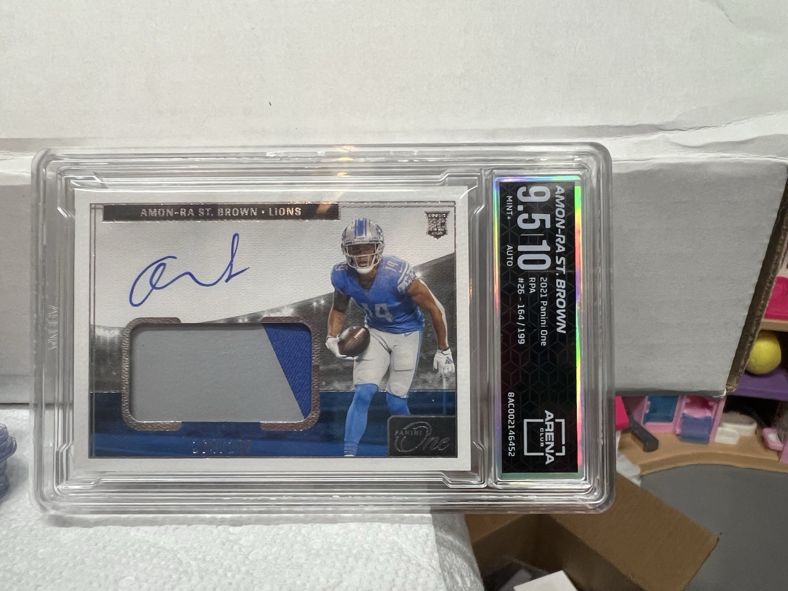 2021 Panini One - Rookie Patch Autograph Amon-Ra St. Brown #26 /199 AU, MEM, RC