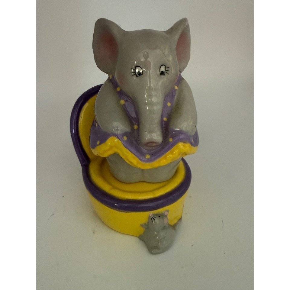 An elephant sitting on a toilet as a salt & pepper set — peak kitschy Americana that earns its place on any shelf demanding a double-take.