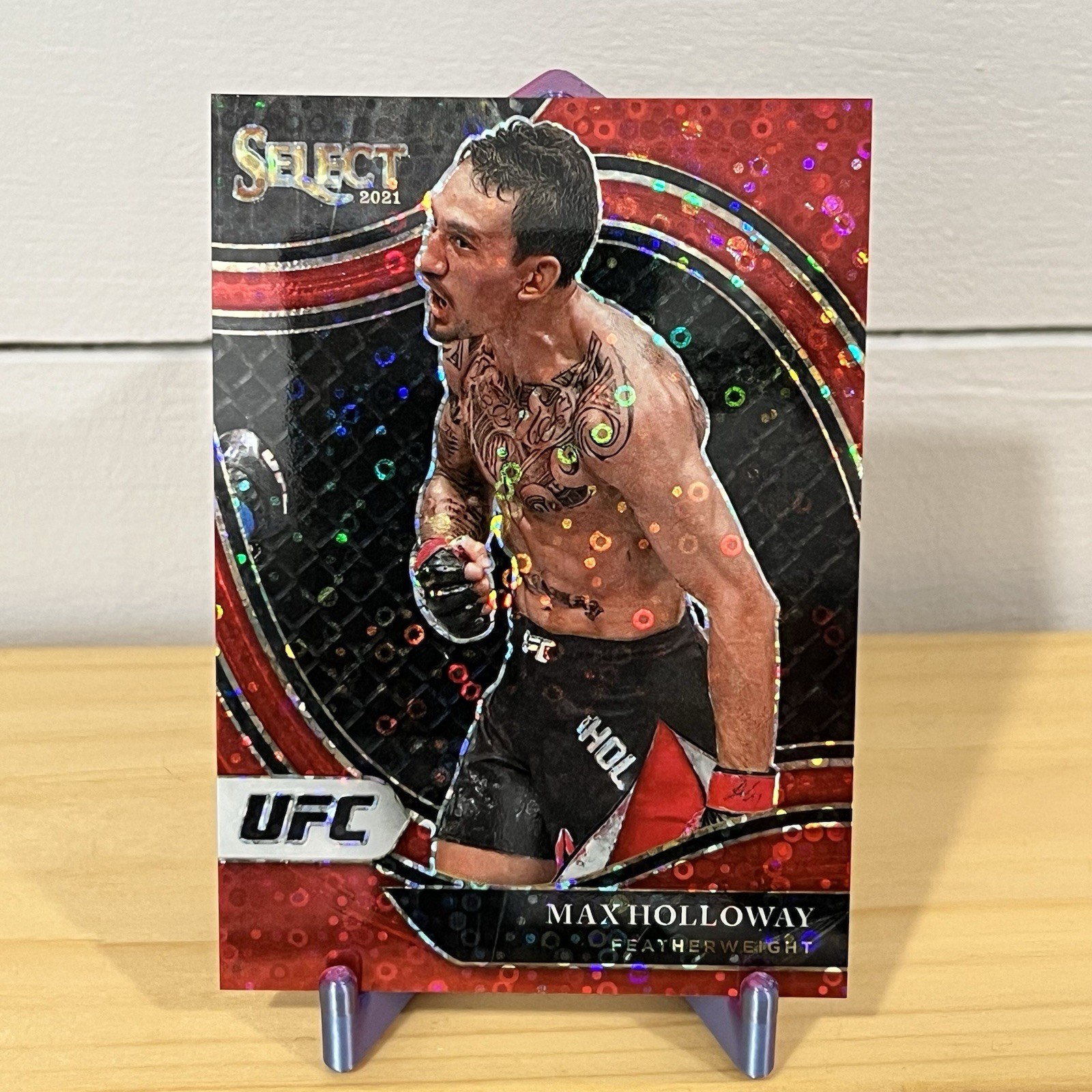 2021 Panini Select UFC Max Holloway Octagonside Red Disco /199