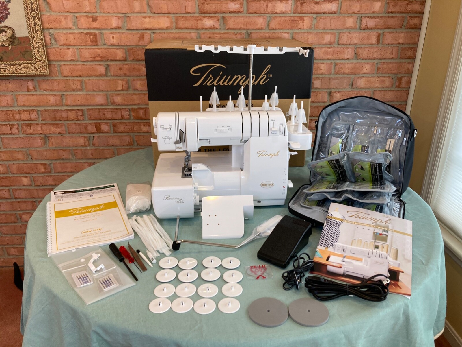 Baby Lock Triumph serger, excellent condition, complete with unused 29