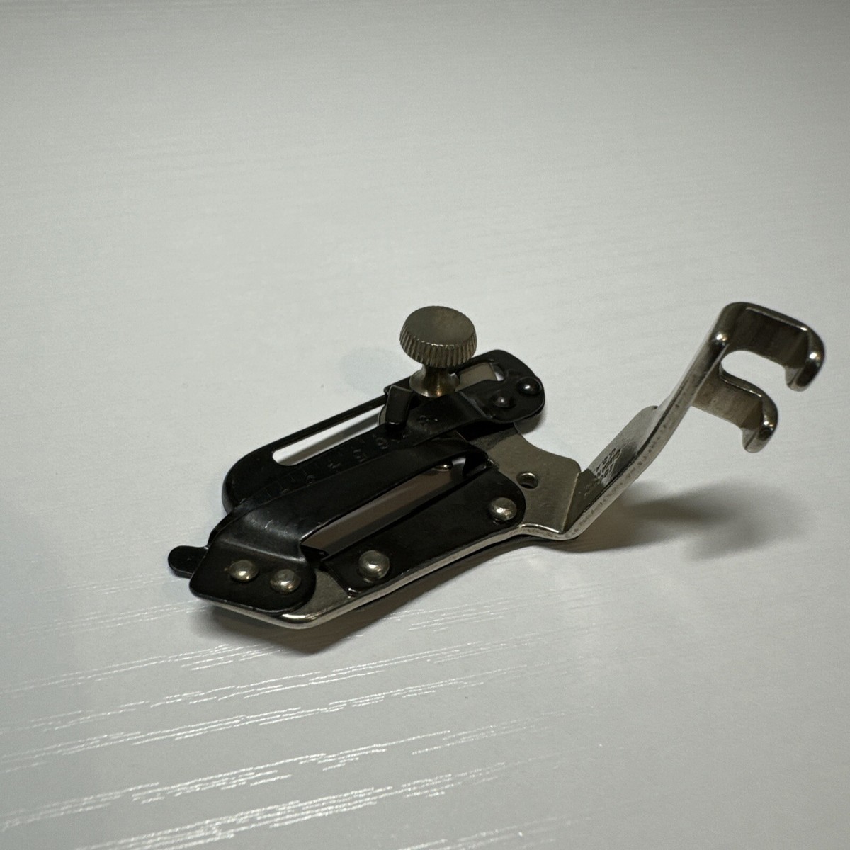 Singer Slant Needle Adjustable Hemmer Foot. Simanco #160626 Singer Slant Needle Adjustable Hemmer Foot. Simanco #160626