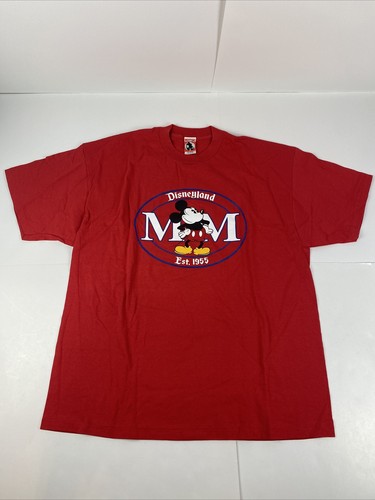 Red vintage Disneyland T-shirt with blue Mickey Mouse logo and “Est. 1955” text, featuring two front stitch circles.