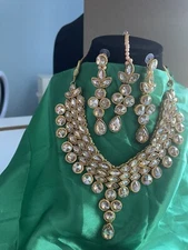 Gold Kundan neck set with earrings and tikka 