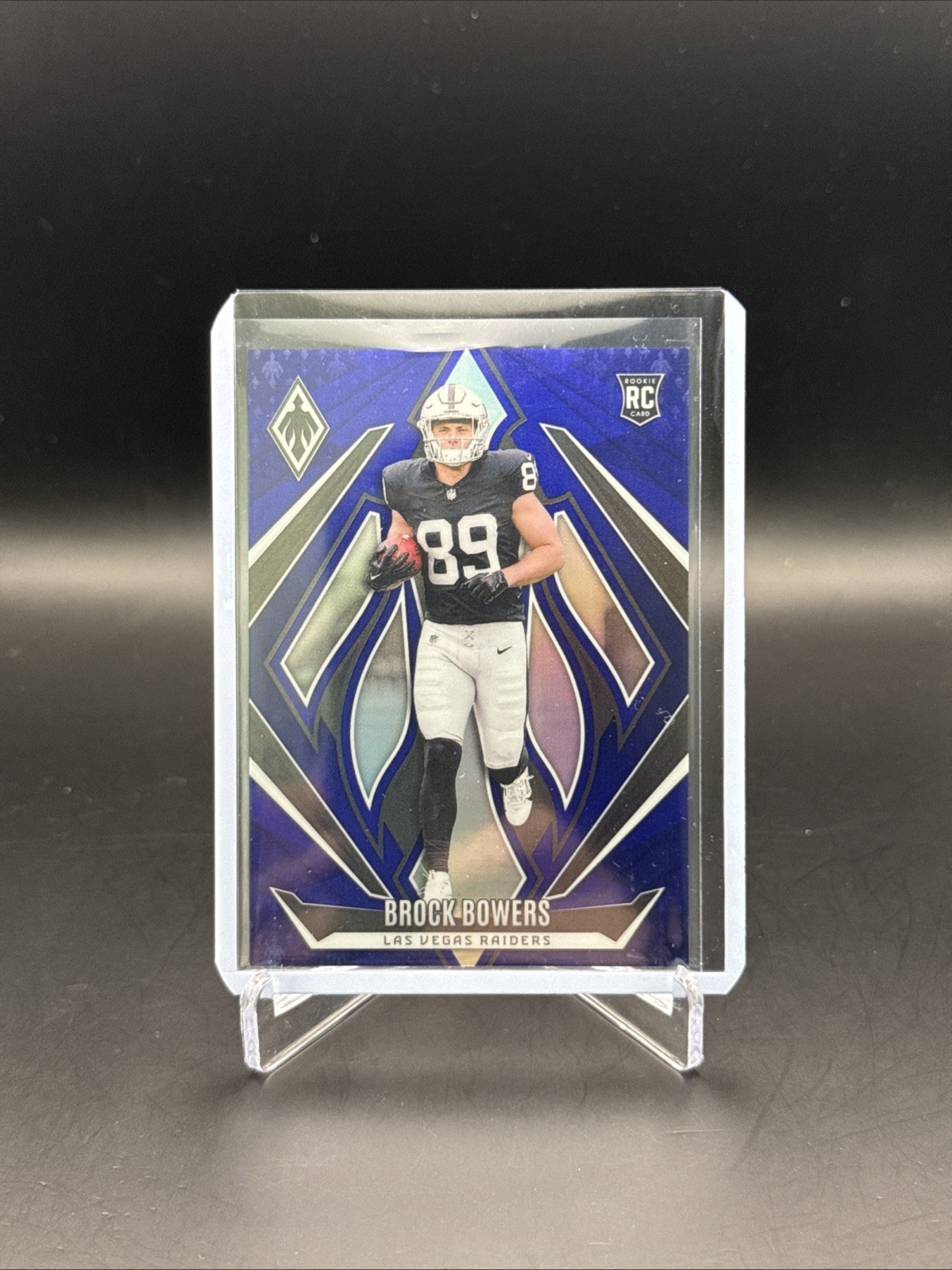 2024 Panini Phoenix Football Brock Bowers RC #165 Blue /50 SP LV Raiders