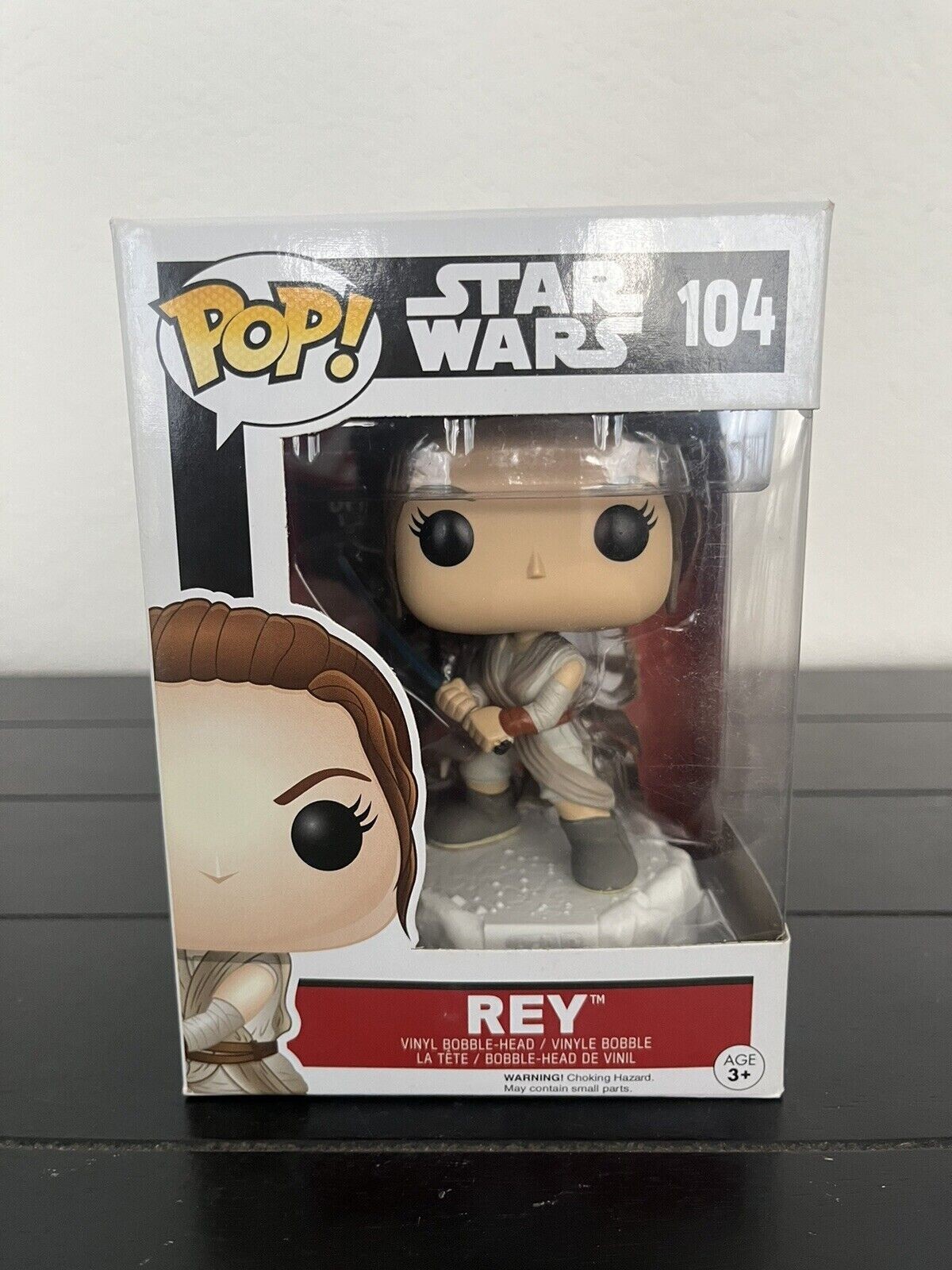Funko Pop! Star Wars - Rey With Lightsaber #104 W/ Pop Protector