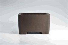Semi cascade  clay brown  bonsai pot outside ...