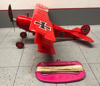 Cox Triplane gas powered aircraft with control line handle.