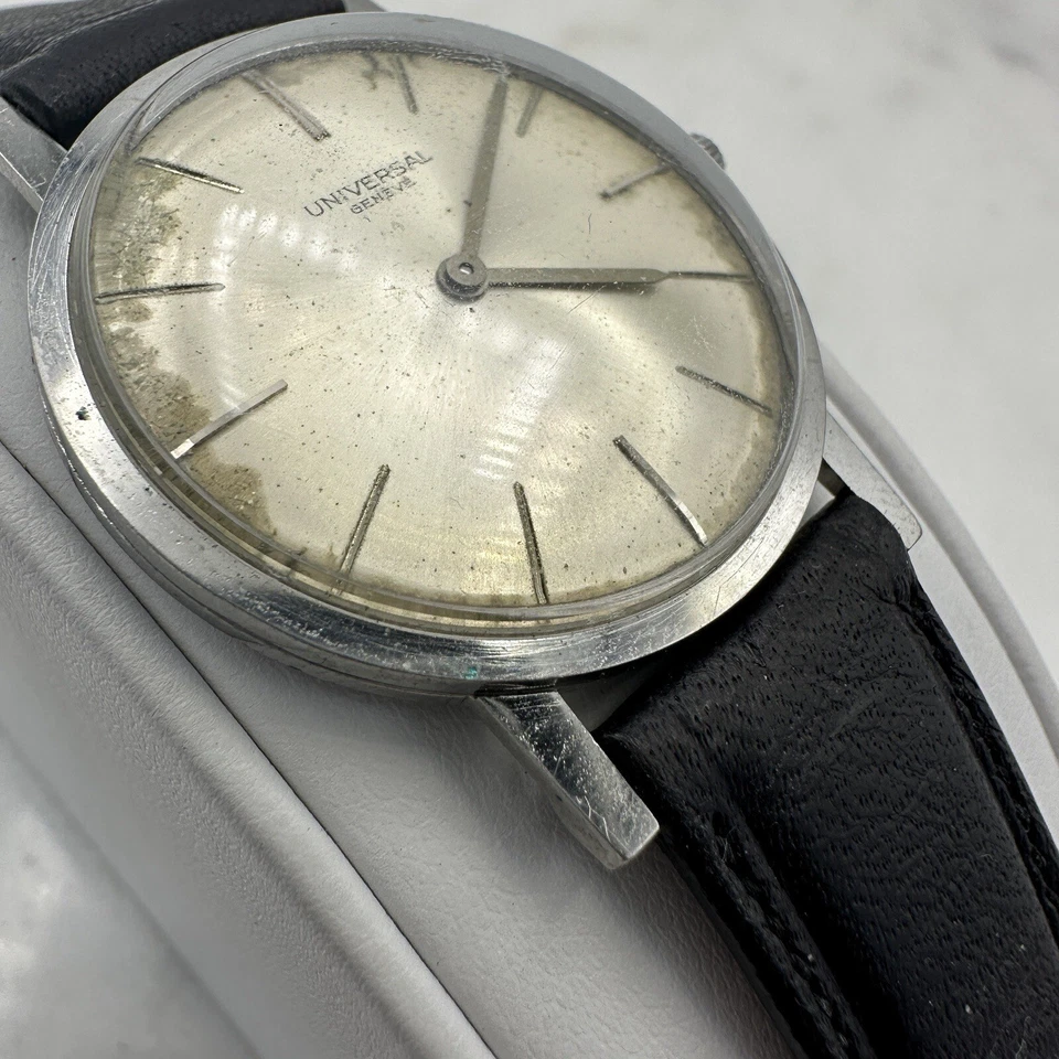 Vintage Universal Geneve Ultra Delgado, Tono Plateado, Cuero Negro, Funcionando, Pátina Foto 2 de 4