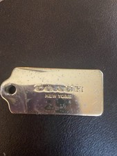 Coach New York Metal Hang Tag Charm Purse with Chain Gold, 1.75'' x 0.75''