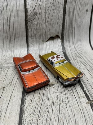Disney Pixar Cars Diecast Rust-Eze Tex Dinoco Gold & Lightning Ramone