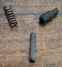 Bolt catch plunger, spring and roll pin