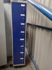 Eight compartment metal locker Dispenser with key for each locker. 