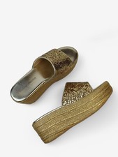Shiny gold flip flops by Ann Demeulemeester o...