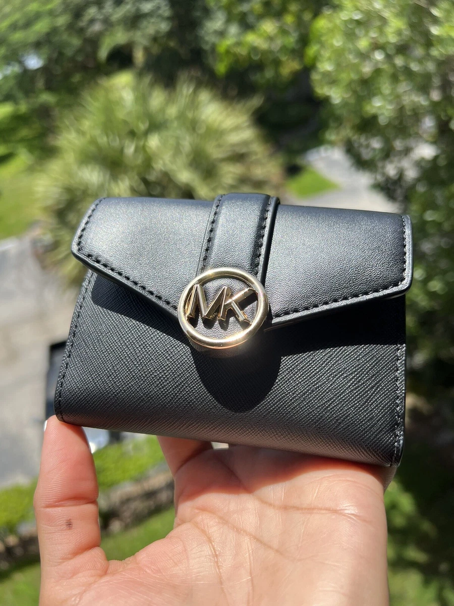 Michael kors wallet hotsell black and gold
