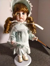 MARIAN YU DESIGNS 10" PORCELAIN DOLL WITH STAND