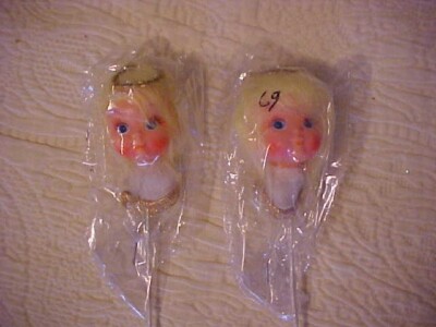 TWO DOLL HEADS, CHERUBS, ON METAL STICKS; BLONDE BLUE EYES HALOS IN PLASTIC