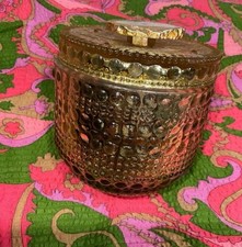 GOLD GLASS JAR WITH CRYSTAL STONE TOP USED TO HOLD A CANDLE TO BE USED AS BOX