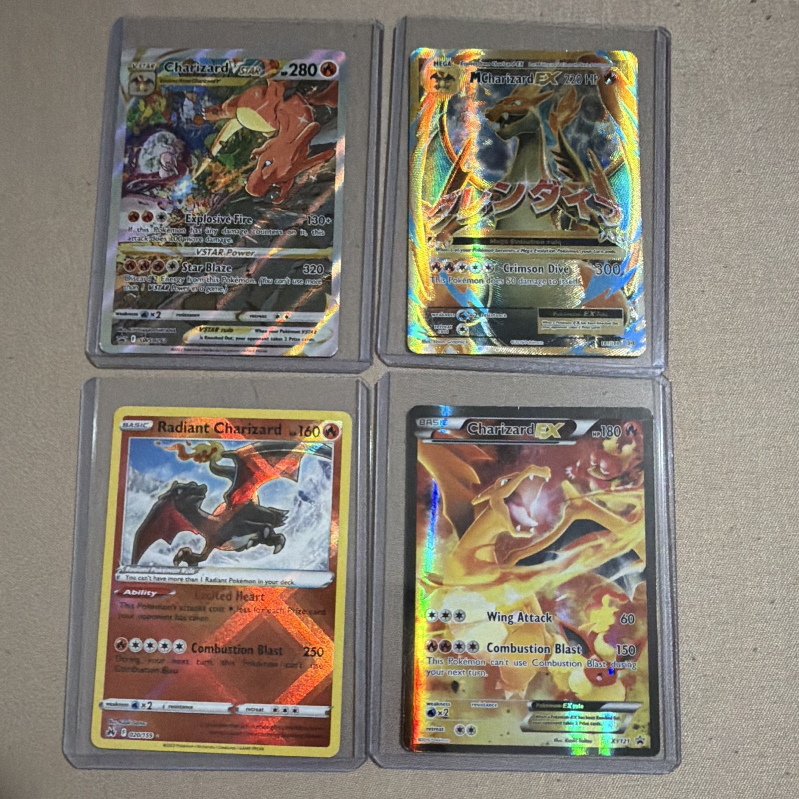 Charizard 4-Card Lot: EX XY121, M EX 100/108, VSTAR SWSH262 Promo, Radiant holo