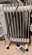 Oil filled radiator with UK Plug-in Energy Monitor Electricity Power Consumption