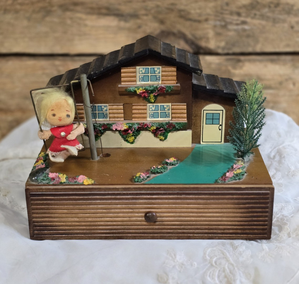 A Reuge Swiss chalet wooden jewelry box with a spinning ballerina — Reuge is THE name in vintage music boxes and this is the real deal, not a knockoff.