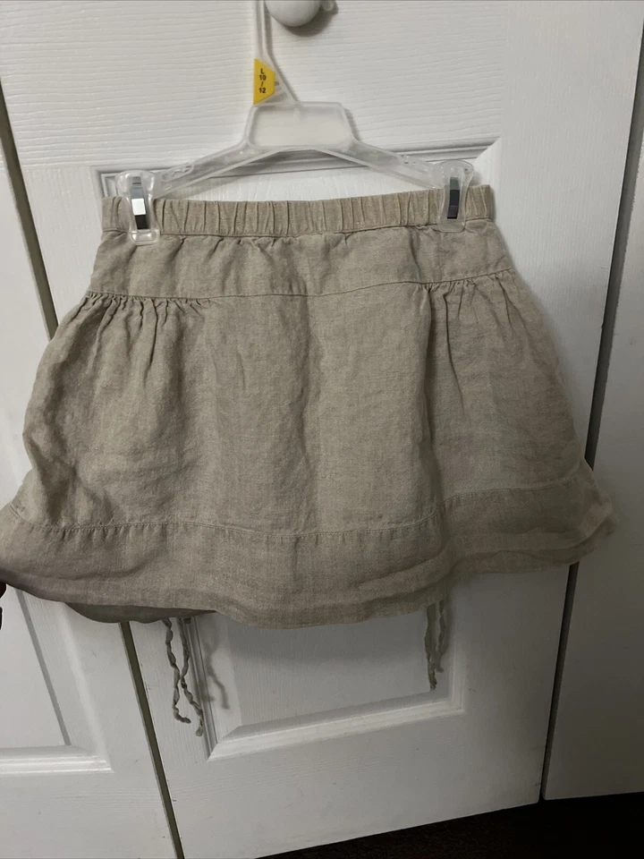 Linda falda gris con volantes y dos bolsillos con alas de papel para niña talla 8 Foto 2 de 4