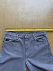 Gray VTG 90s Wrangler straight leg cowboy pants with five pockets, button closure, and yellow measuring tape across the waistband.