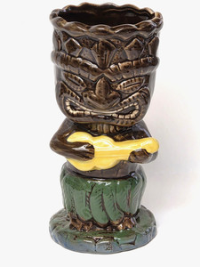 Ceramic Tiki Mug 7" Brown Tiki with Green Skirt Playing a Yellow Ukulele