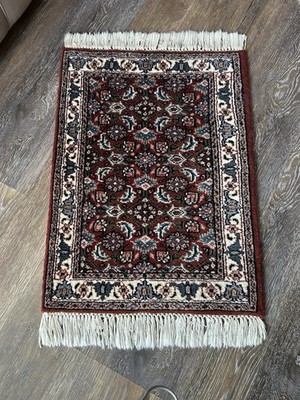 Hand-knotted wool Persian or Turkish small area rug w/traditional floral motifs
